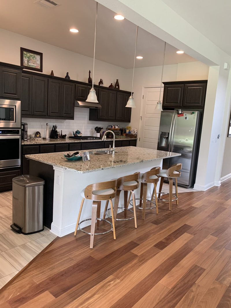 Solid Hardwood Floors Brazilian Teak Cumaru Pre-finished 5 premium Collection SHWSAC237 installed on kitchen where there is island countertop and dark color cabinets