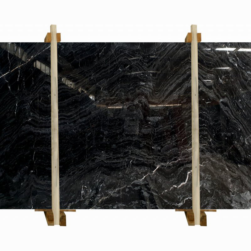 black wave marble slabs polished packed on wooden bundle product shot view