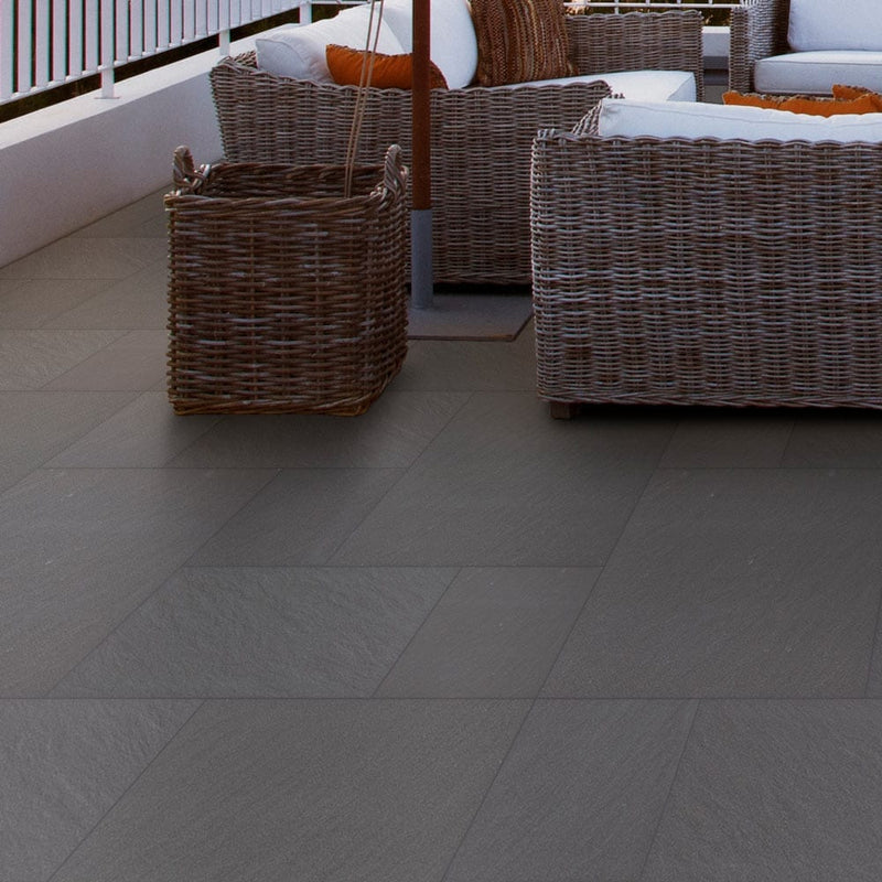 blue-stone-porcelain-pavers-4-sized-pattern-matte-floor-tile-LPAVNBLUSTOPAT-installed-on-terrace-floor-ocean-view-closeup