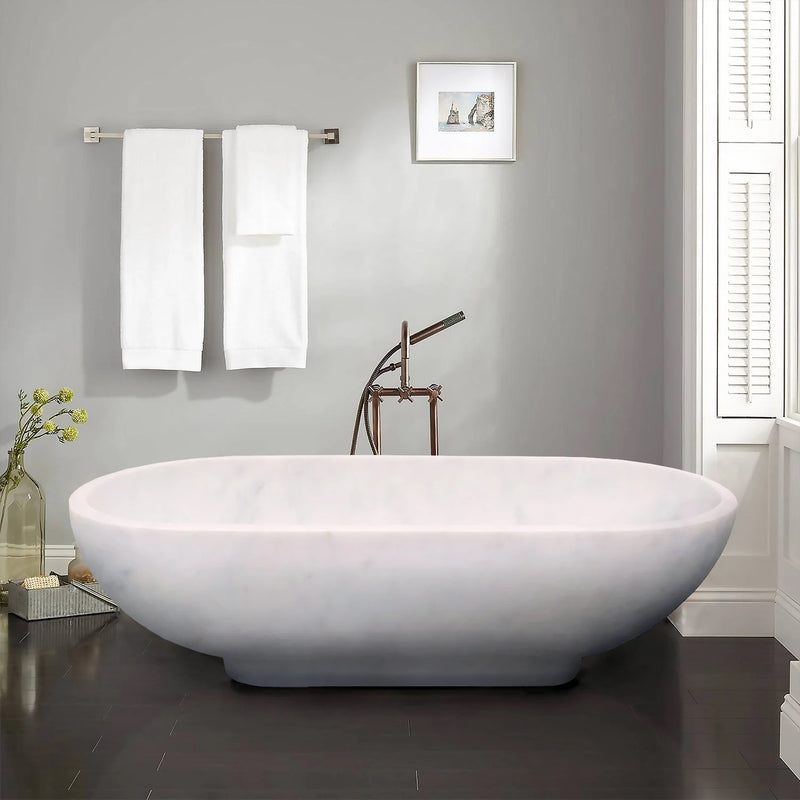 Bianco Carrara White Marble Bathtub Hand-carved from Solid Marble Block (W)30" (L)70" (H)20" installed modern bathroom white towels Hund on the wall black marble flooring and white windows and blinds on the side 