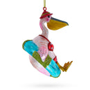 Pelican in Red Swimsuit with Hat on Pool Float Glass Christmas Ornament