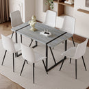 Table and chair set. Modern minimalist grey marble textured MDF dining table with metal frame. Comes with 6 chairs with PU cushions and black metal legs.