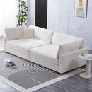 The 112-inch beige corduroy sofa, with two throw pillows and four backrests, has opened up a new style for the living room's leisure area