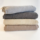 Ekani Throw Blankets