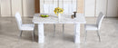 Table and chair set.64.5x35.4 Inch Stylish White Marble Textured Dining Table.Paried With 4 White PU Chairs with a vertical stripe design on the backrest.Create Your Exclusive Low-Key Luxury Space.