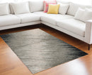 5' X 8' Silver Grey Machine Woven Abstract Brushstroke Indoor Area Rug