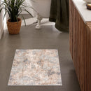 7' X 10' Beige And Ivory Abstract Area Rug