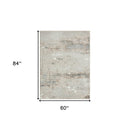 5' X 7' Beige Gray And Brown Abstract Stain Resistant Area Rug