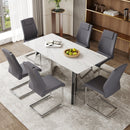 Table and chair set.63'x31.5x30' Luxurious Snow Mountain Patterned Sintered Stone Table with Silver Metal Butterfly Legs.Paried With 6 Dark Gray High-quality PU Chairs With Arched Metal Legs.
