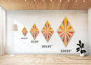 Pastel Radiance — Diamond Shaped Canvas Art Print brightens any playroom wall with sunshine burst design nursery decor colorful modern tones