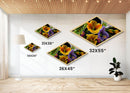 Midnight Bloom Glow Diamond Shaped Canvas Embossed Print with bold floral close-up, colorful petals on black, dramatic flower wall art