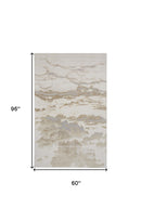 4' X 6' Ivory Tan And Gray Abstract Area Rug