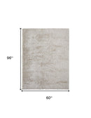 5' X 8' Ivory Shag Power Loom Stain Resistant Area Rug