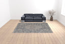 7' X 10' Blue And Ivory Floral Power Loom Stain Resistant Area Rug