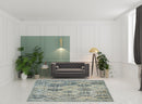 8' X 11' Green Blue And Ivory Abstract Power Loom Distressed Stain Resistant Area Rug