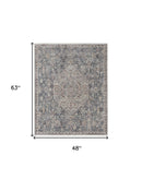 7' X 10' Blue And Ivory Floral Power Loom Stain Resistant Area Rug