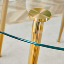A modern minimalist style round transparent tempered glass table with gold metal legs, paired with 4 modern PU leather high-back dining chairs, bring a luxurious experience.