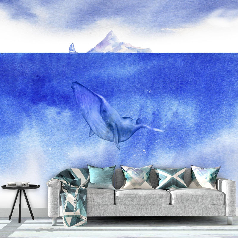 Whale in Ocean Wall Mural. Watercolor artwork of whale, island and sailboat. Peel and Stick Wallpaper.