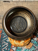 Tibetan Singing Bowl etched Om Mani Padme Hum symbols, carved on the inside