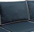 Brown Wicker Outdoor Sofa with Navy Cushions for Comfort