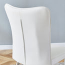 Table and chair set.64.5x35.4 Inch Stylish White Marble Textured Dining Table.Paried With 4 White PU Chairs with a vertical stripe design on the backrest.Create Your Exclusive Low-Key Luxury Space.
