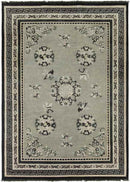 Folkston Traditional Black/Dark Green Area Rug