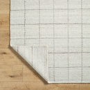 Ishaq Solid and Border Ivory Area Rug