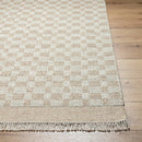 Clinten Solid and Border Tan Area Rug
