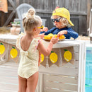 RuffleButts Girls Seersucker One Piece with Roshambo Yellow Sunglasses