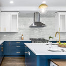 Aquatica cocco 6.5x15.25 interlocking brick porcelain tile loose dany series KRADANYCOCCO616 installed kitchen blue cabinets island top in the middle gold faucet