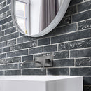 Aquatica mora black 6.5x15.25 interlocking brick porcelain tile loose dany series KRADANYMORA616 installed bathroom wall round mirror on wall faucet chrome color wall-mounted white rectangular bathroom sink