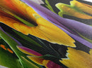 Midnight Bloom Glow Diamond Shaped Canvas Embossed Print with bold floral close-up, colorful petals on black, dramatic flower wall art