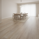 Modern dining room with wooden table and chairs on a light wood floor.