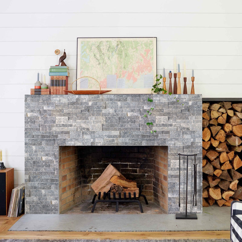 Bluestone Ledger 3D Panel 6"x24" Natural Marble Wall Tile - Full Truckload installed around fireplace wood storage area wooden candle holders on top of the mantel