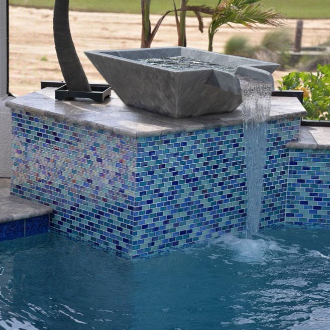 Bluestone marble natural stone pool cascad water bowl installed near pool top