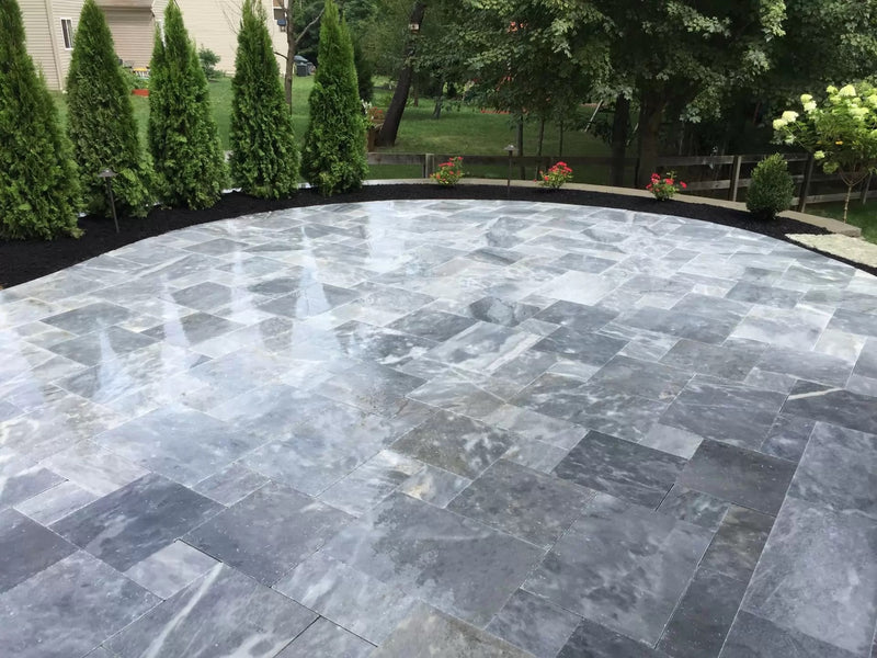 Bluestone marble pavers tumbled pattern installed patio outdoor wide view