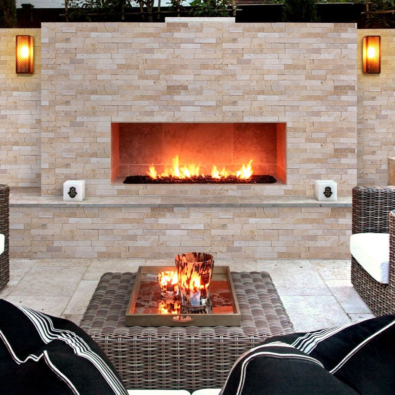 Camden Ivory Ledger 3D Panel 6x24 Multi-surface Natural White Travertine Wall Tile installed outside fireplace patio