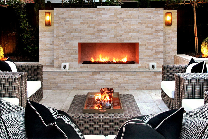 Camden Ivory Ledger 3D Panel 6x24 Multi-surface Natural White Travertine Wall Tile installed outside fireplace patio wide view