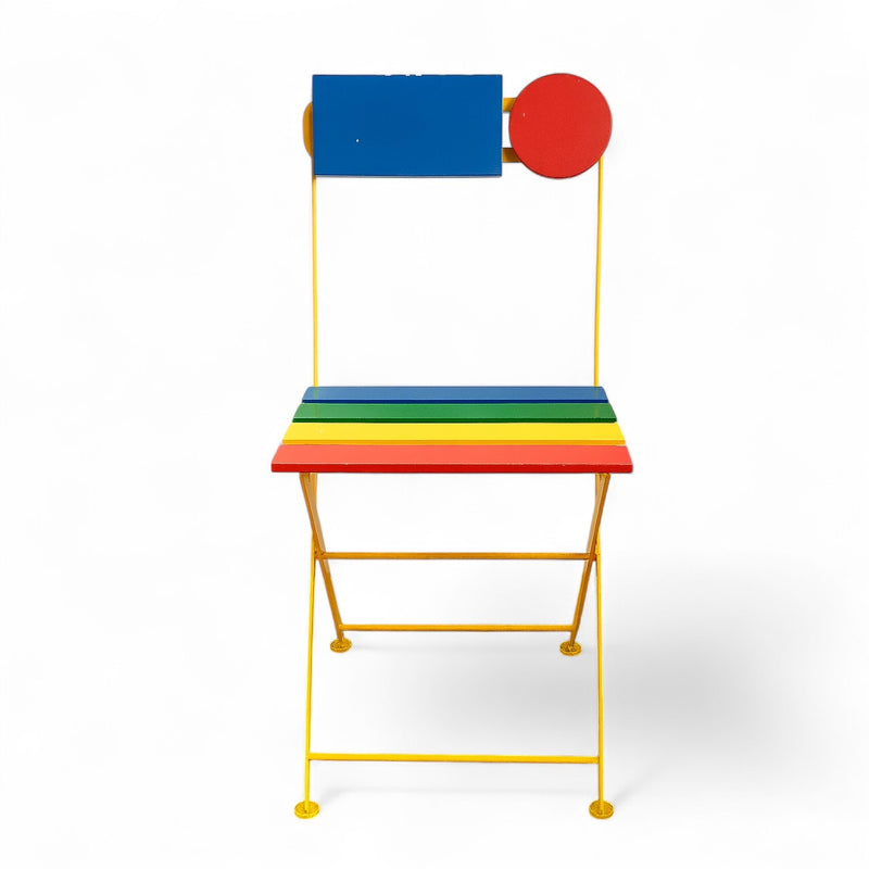 Colorful chair with a rainbow seat and blue and red backrest on a white background