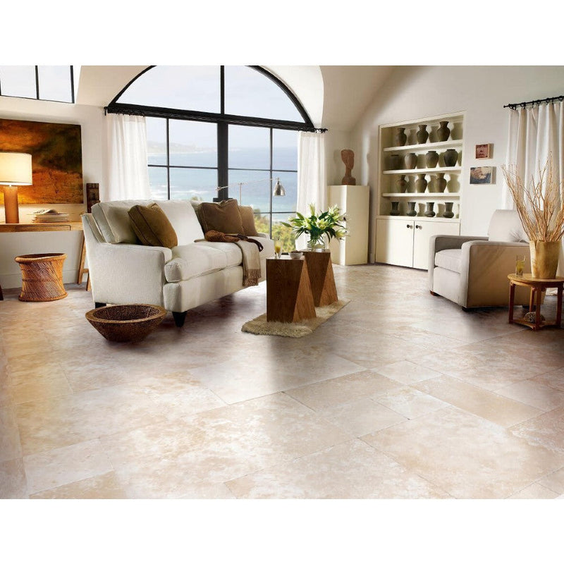 Denizli Beige Antique Pattern Travertine Tile - Full Truckload brushed and eased edge installed condo floor with beige couch and wooden side tables flower on top