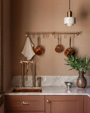 Elegant Unlacquered Brass Kitchen Faucet with Tall Legs and Unique Elephant Trunk Spout