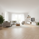 Modern living room with white walls, wooden floor, and minimal decor.