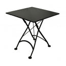 Black metal folding table on a white background