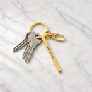 Good As Gold Stamped Bar Keychain in Gold | Minimalist Metal Quote Keychain