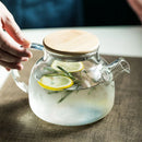 DecorBites™ 1.8L Transparent Borosilicate Glass Teapot | Heat-Resistant Flower Tea Set
