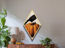Crow atop jack-o-lantern Canvas Embossed Print with rich Halloween gothic tones in dramatic Diamond Shaped Art presentation