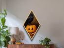 Midnight crow guarding carved pumpkin Canvas Art Print in Diamond Shaped Art with moody gothic ambiance and Halloween spirit