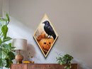 Pumpkin patch crow with eerie stare Canvas Embossed Print in Diamond Shaped Art layout with Halloween gothic and spooky vibes