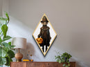 Spooky child scarecrow with glowing eyes Canvas Embossed Print holding jack-o-lantern in creepy Victorian Diamond Shaped Art