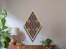 Royal Deco Mirage – Diamond Shaped Canvas Textured Print with purple gold repeating motif, symmetrical kaleidoscope retro wall pattern
